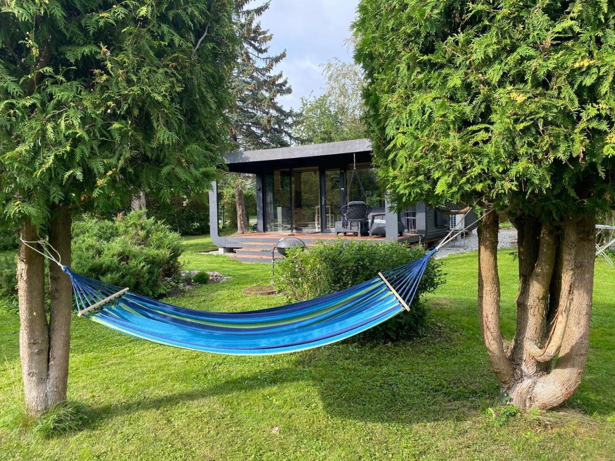 A Tiny House With A Garden And A Hot Tube